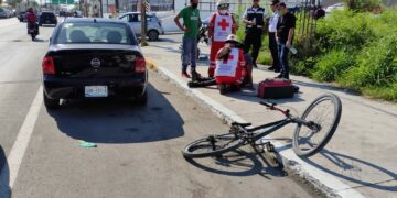 Arroyan menor a bordo de su bicicleta en el 10 Carrera 